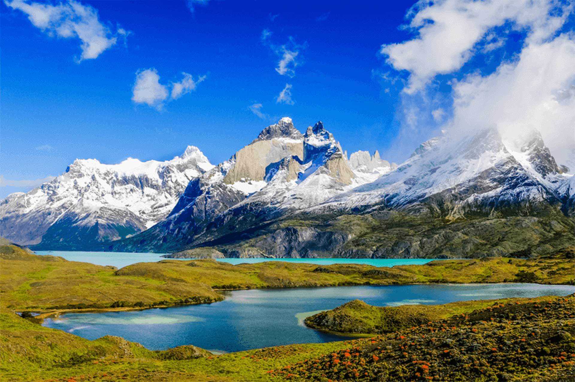 Dramatic granite mountains reflected in a glacial lake in Patagonia.